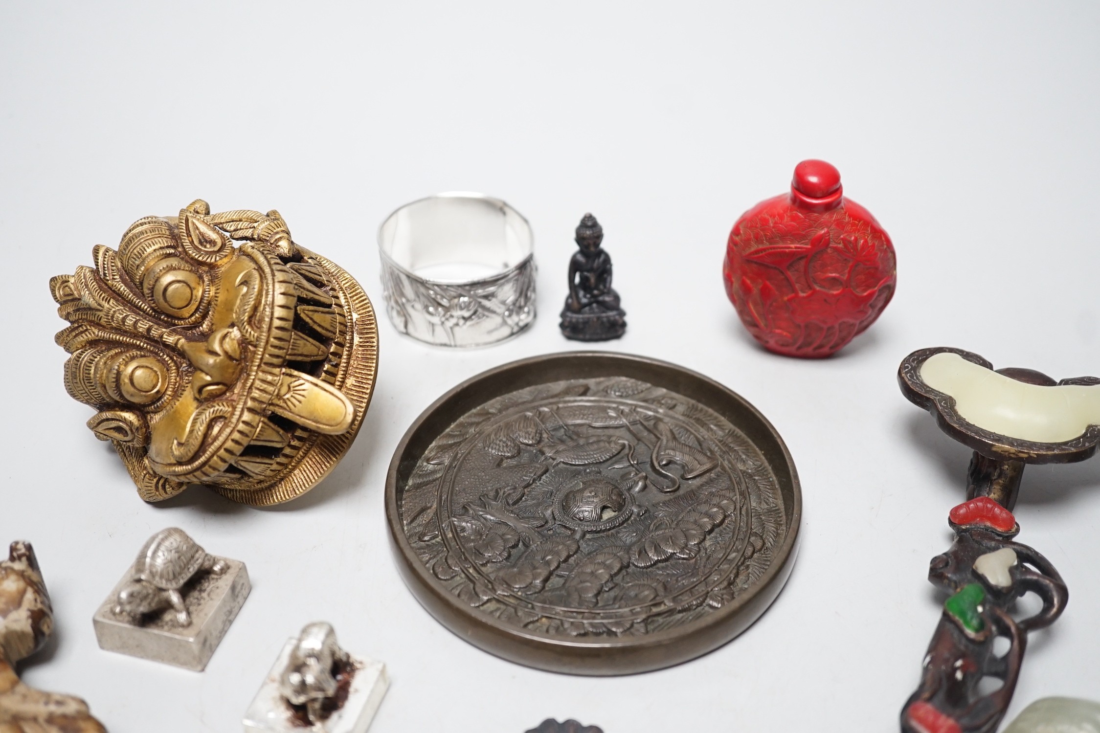 A selection of various Oriental items, including Chinese hardstone carvings, Japanese cast bronze mirror, snuff bottle, Japanese napkin ring etc.